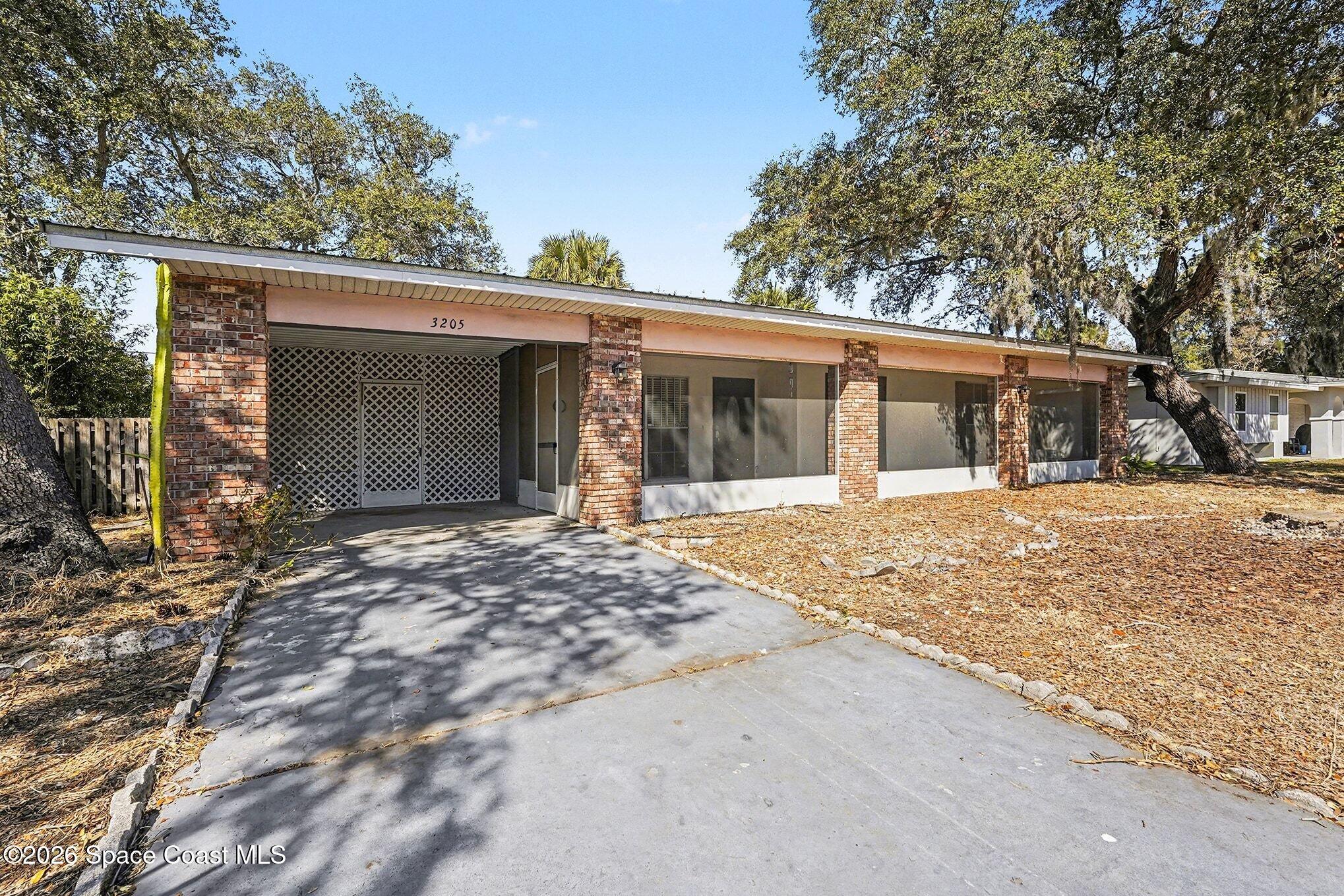 3205 Dade Circle Northeast Palm Bay, FL 32905 - Photo 7 of 35 front view of a house with a outdoor space