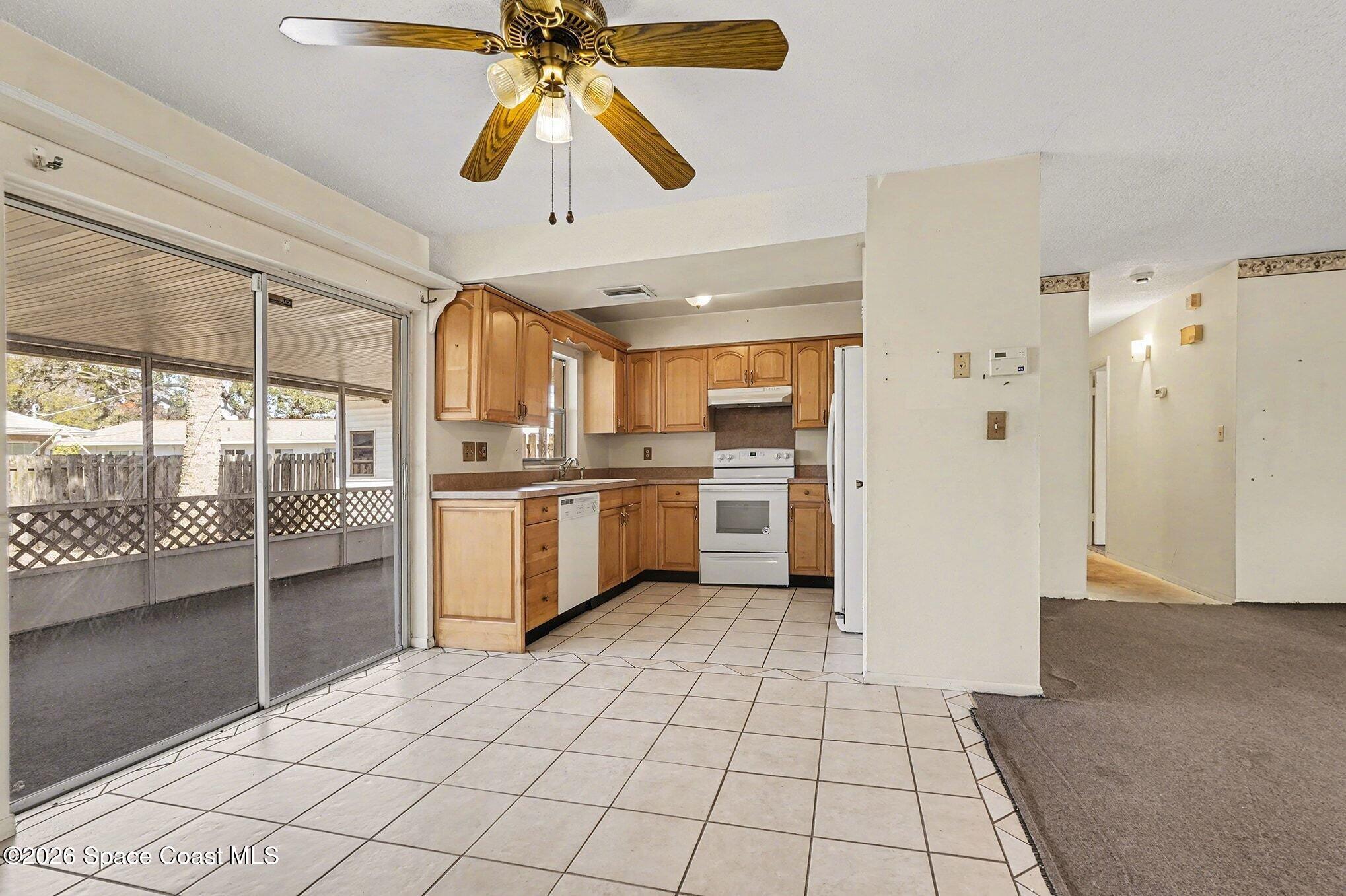 3205 Dade Circle Northeast Palm Bay, FL 32905 - Photo 10 of 35 a view of a kitchen with a sink and cabinets