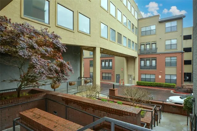 an aerial view of residential houses with outdoor space and street view