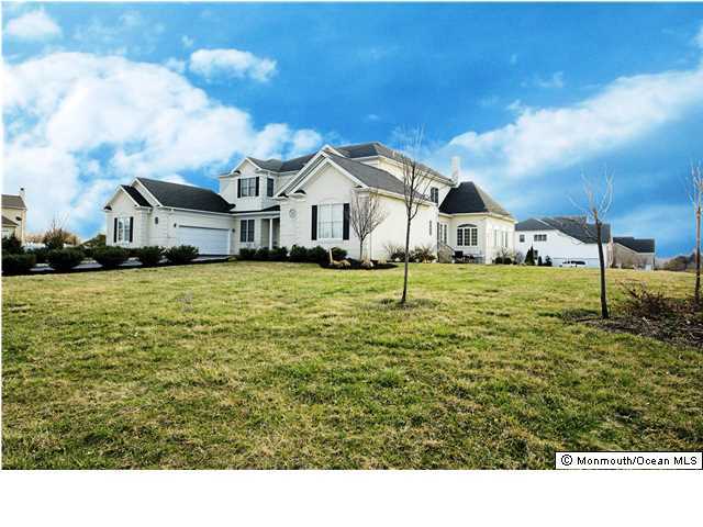 2 Grant Drive Cream Ridge, NJ 08514 - Photo 2 of 3 a white house with a big yard and large trees