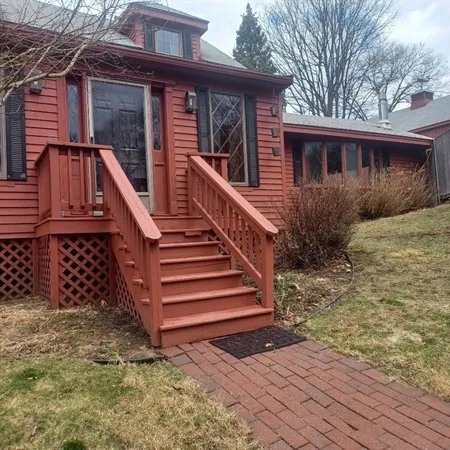 a view of a house with wooden floor and fence