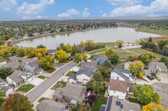 an aerial view of a city with lake view