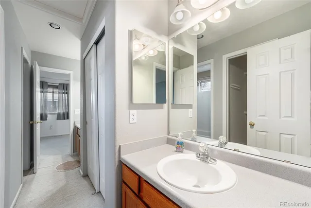 a en suite bathroom with a sink and a mirror