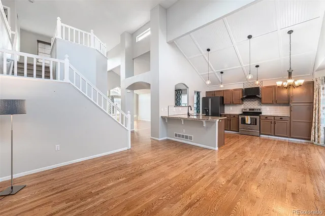 a view of kitchen with furniture and wooden floor