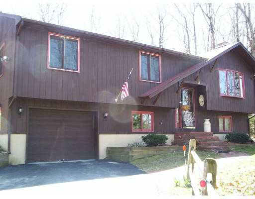 60 Dodge Road Sutton, MA 01590 - Photo 1 of 16 a view of a house with a patio