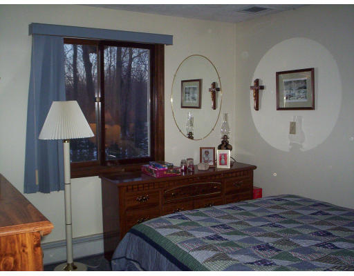 60 Dodge Road Sutton, MA 01590 - Photo 13 of 16 a bedroom with a bed and a table
