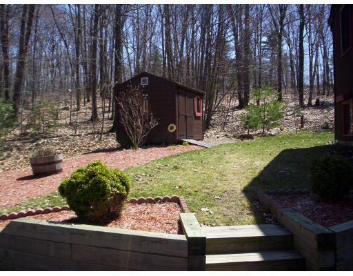 60 Dodge Road Sutton, MA 01590 - Photo 15 of 16 a view of a garden with an outdoor space