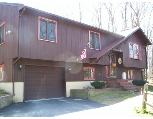 60 Dodge Road Sutton, MA 01590 - Photo 2 of 16 a front view of a house with a yard