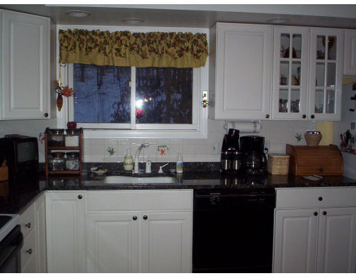60 Dodge Road Sutton, MA 01590 - Photo 7 of 16 a kitchen with granite countertop a sink a stove and cabinets