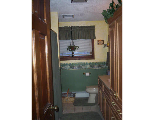 60 Dodge Road Sutton, MA 01590 - Photo 8 of 16 a bathroom with a toilet and a shower curtain