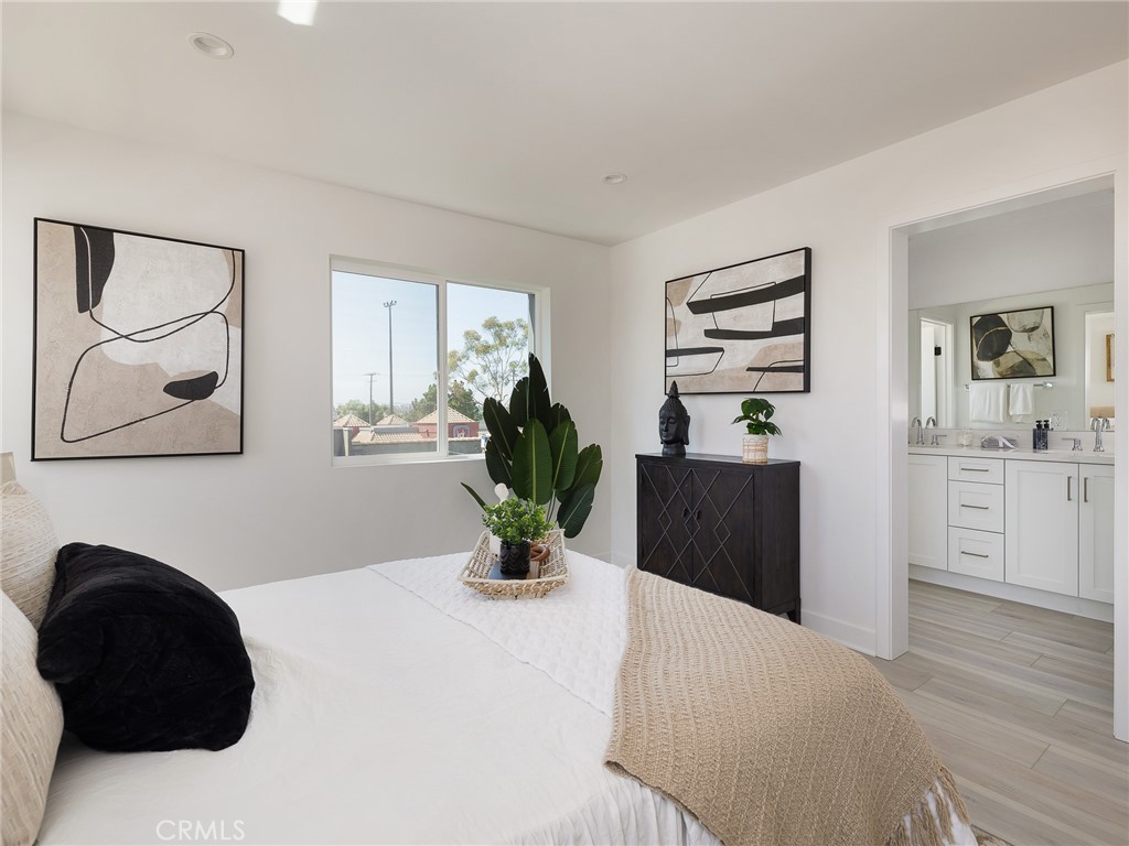 121 East 223rd Street, Unit 1 Carson, CA 90745 - Photo 16 of 35 a bedroom with a bed and a cabinets