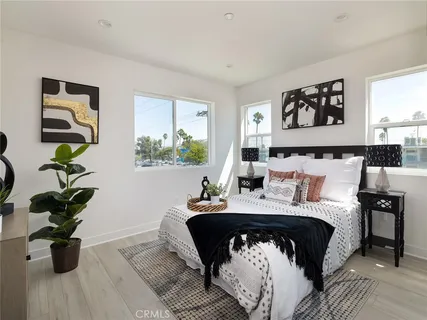 a bathroom with a sink a mirror a toilet and shower