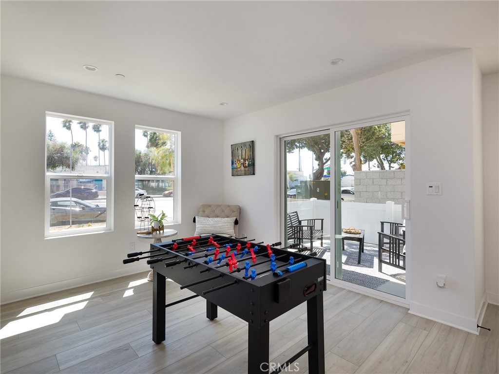 121 East 223rd Street, Unit 1 Carson, CA 90745 - Photo 22 of 35 a living room with furniture and a floor to ceiling window