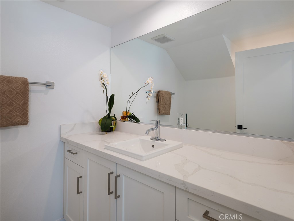 121 East 223rd Street, Unit 1 Carson, CA 90745 - Photo 24 of 35 a bathroom with a sink and a mirror