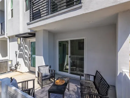 a living room with furniture potted plant and a window