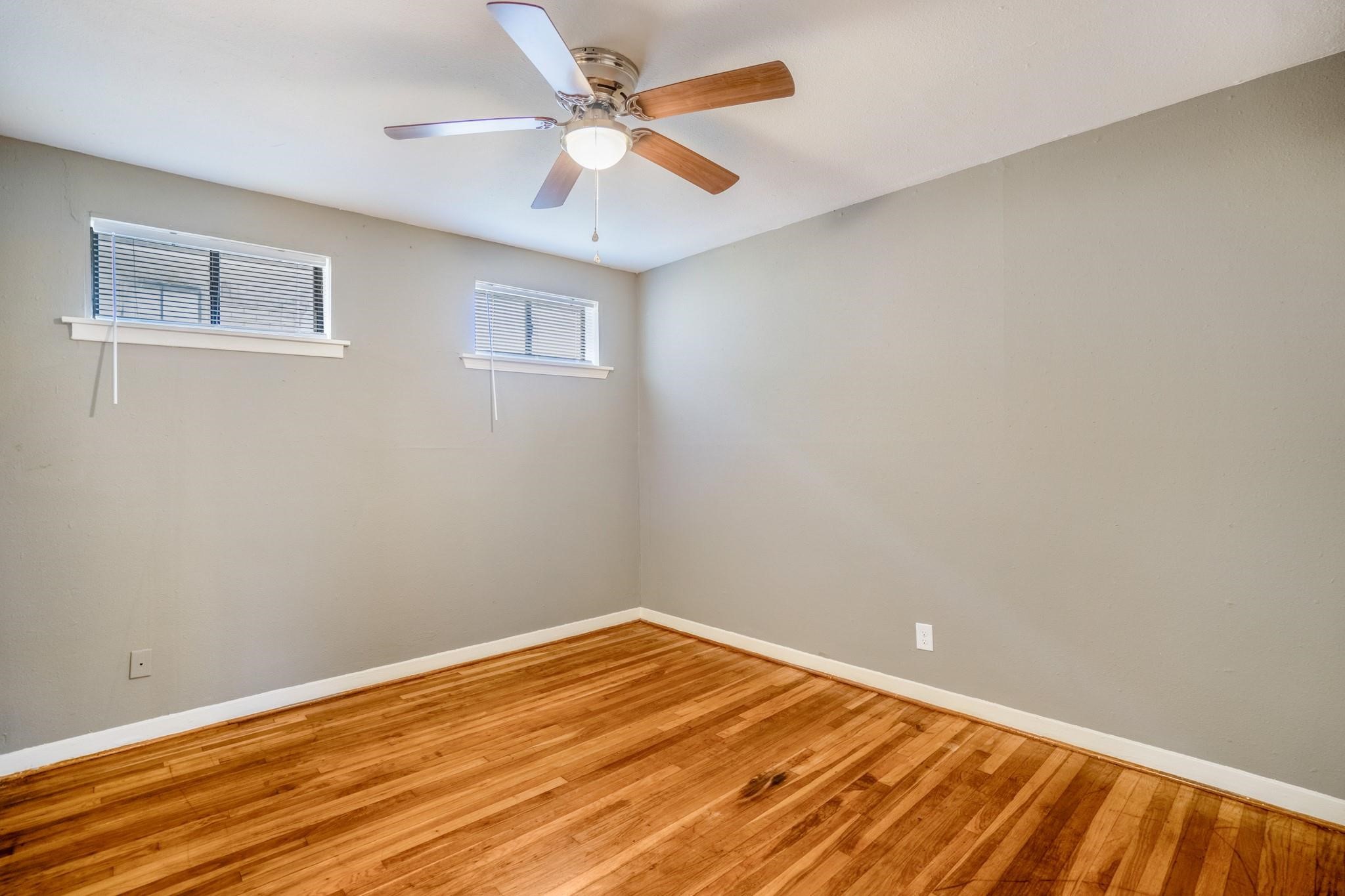 4720 Delano Street Houston, TX 77004 - Photo 8 of 12 a view of empty room with wooden floor