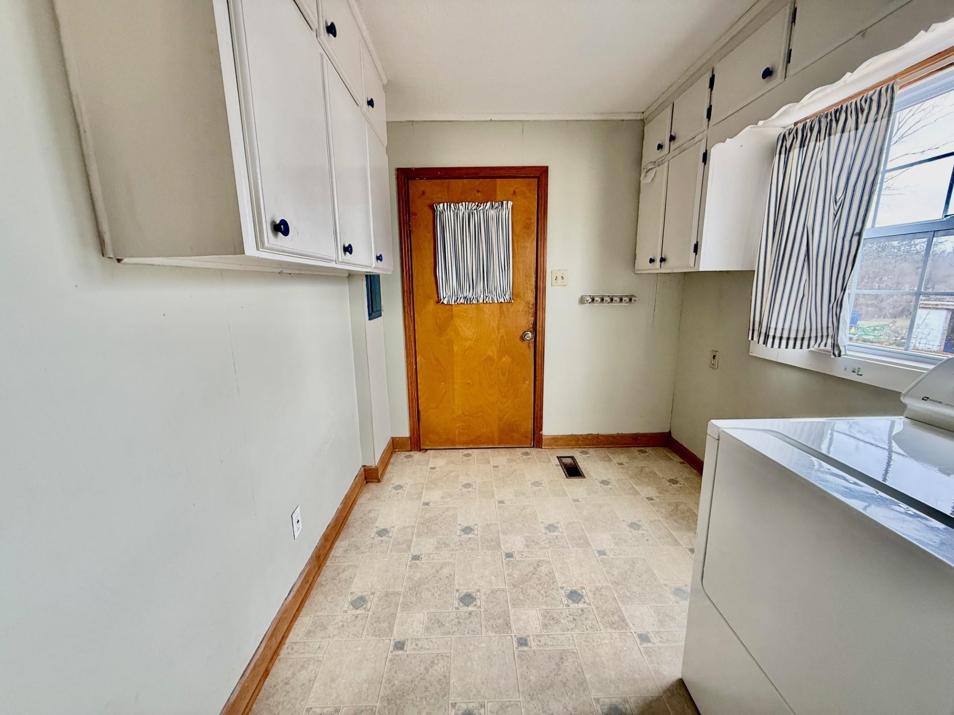 1880 Atoka Idaville Road Atoka, TN 38004 - Photo 4 of 15 a view of a kitchen with wooden floor