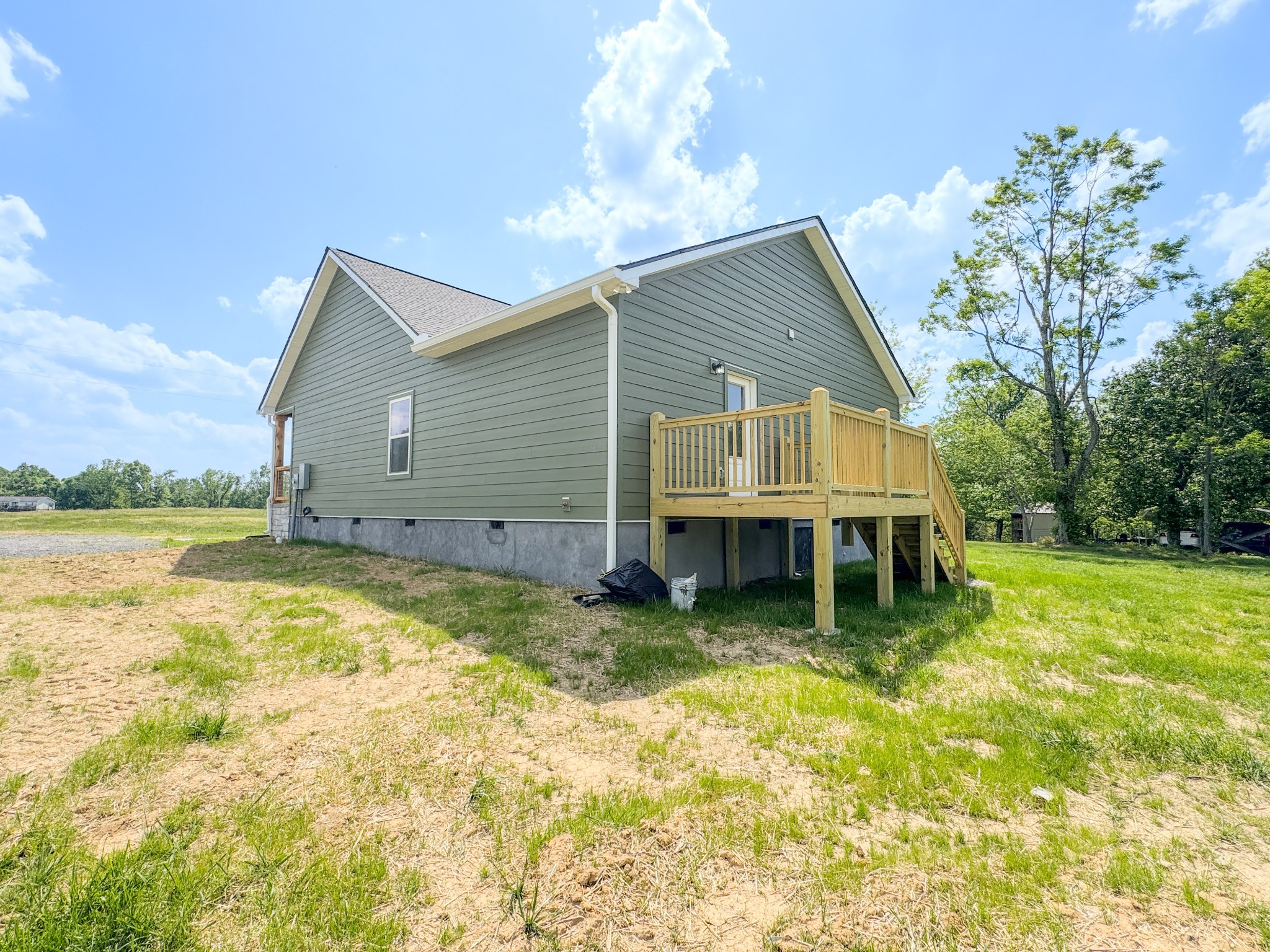 181 Rock House Hollow Road Bethpage, TN 37022 - Photo 9 of 51 a view of a house with pool and a yard