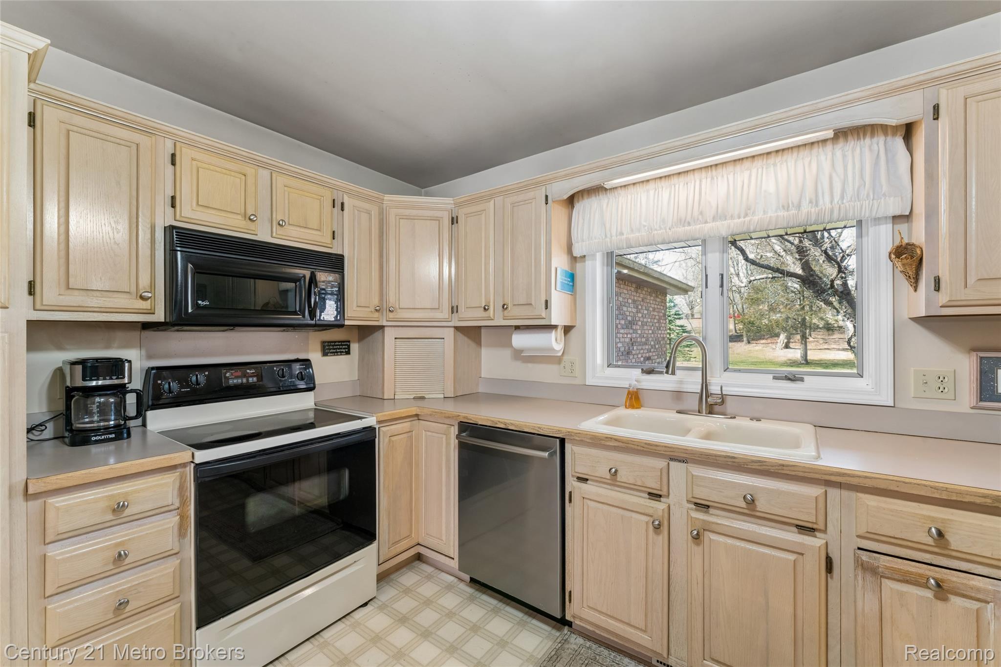 5464 North Seymour Road Flushing, MI 48433 - Photo 20 of 59 Kitchen with electric stove, light countertops, black microwave, stainless steel dishwasher, and light flooring