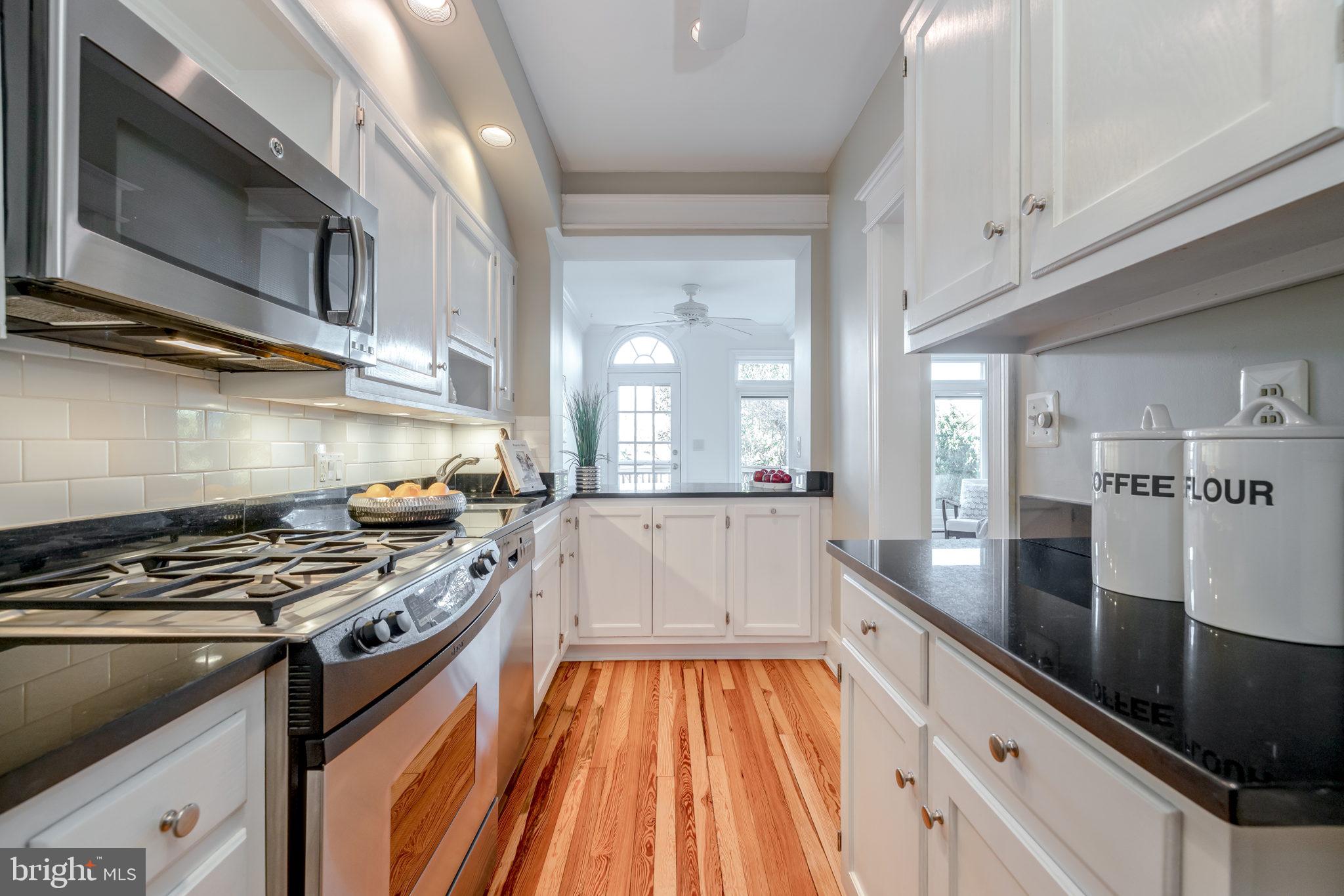 1919 38th Street Northwest Washington, DC 20007 - Photo 10 of 43 Breakfast bar is open to the rear family room