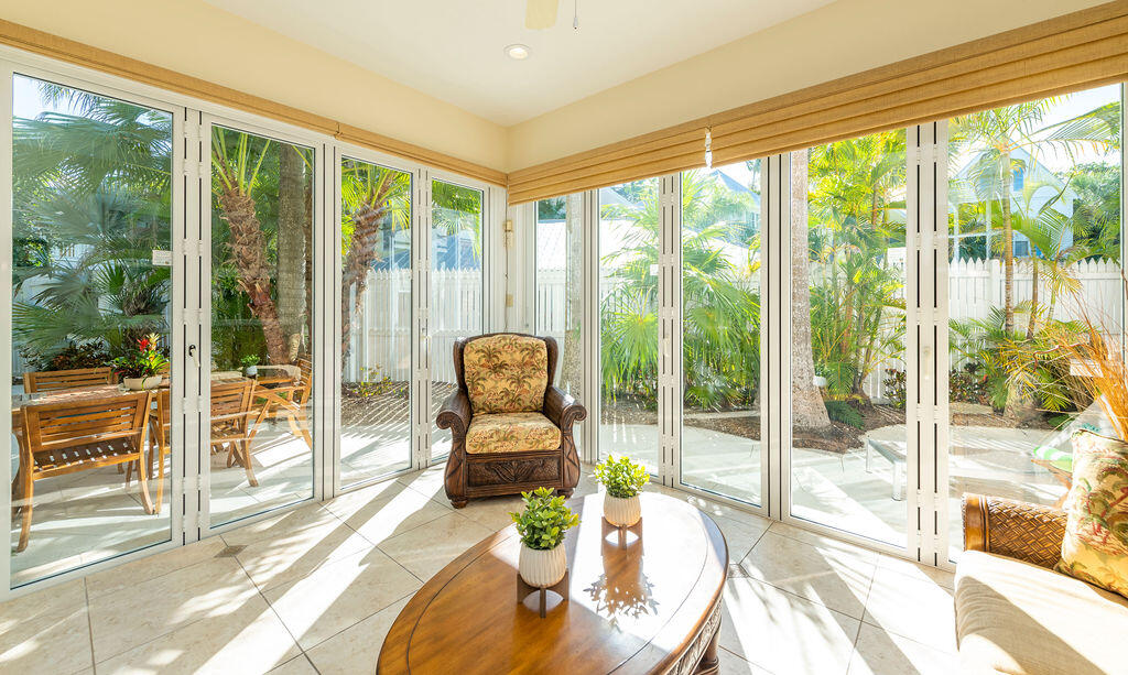 202 Admirals Lane Key West, FL 33040 - Photo 2 of 59 a living room with furniture and floor to ceiling windows