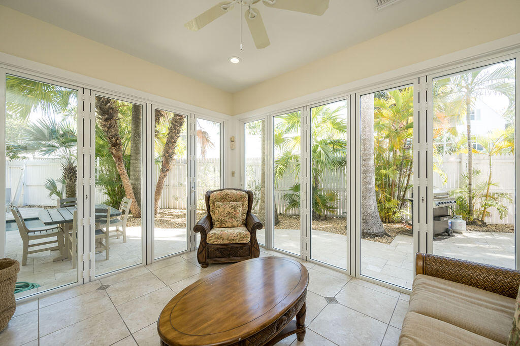 202 Admirals Lane Key West, FL 33040 - Photo 27 of 57 a living room with furniture and a floor to ceiling window