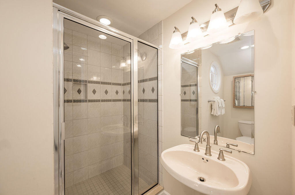 202 Admirals Lane Key West, FL 33040 - Photo 30 of 59 a bathroom with a sink shower and a mirror