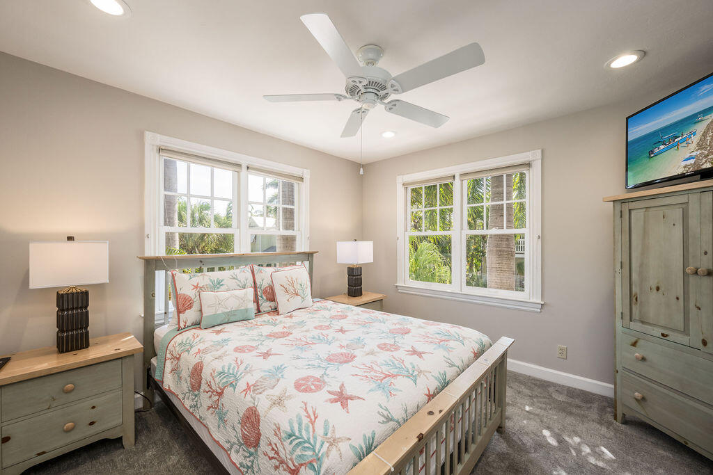 202 Admirals Lane Key West, FL 33040 - Photo 34 of 57 a bedroom with a bed and a window