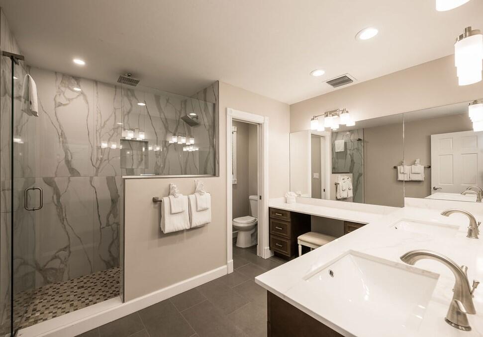 202 Admirals Lane Key West, FL 33040 - Photo 41 of 57 a large bathroom with a double vanity sink and a mirror