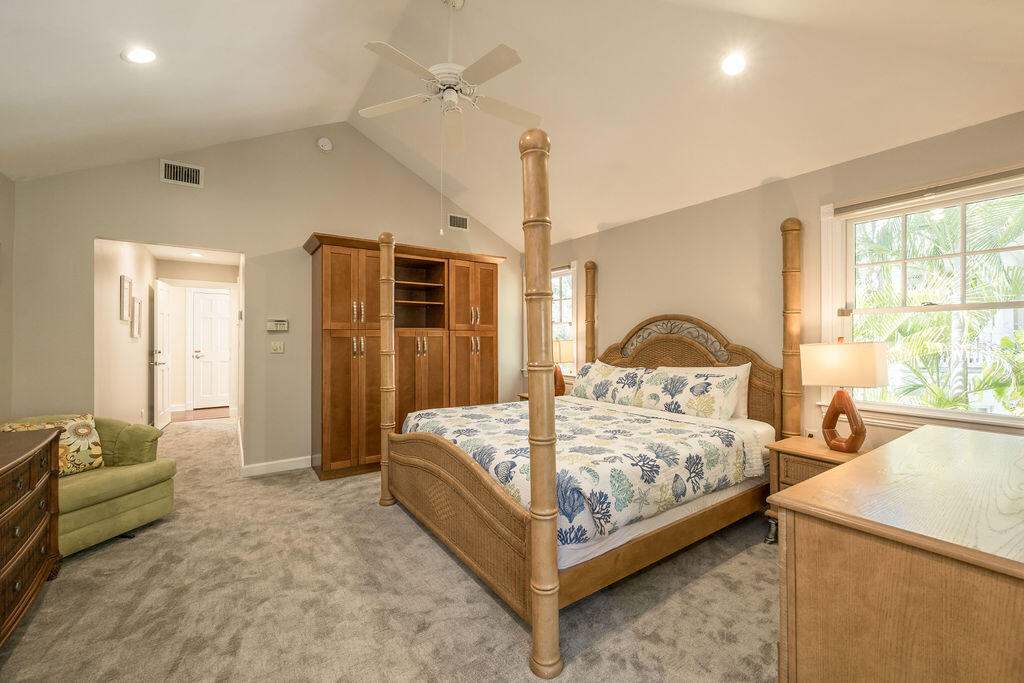 202 Admirals Lane Key West, FL 33040 - Photo 46 of 57 a bedroom with a bed a window and a couch