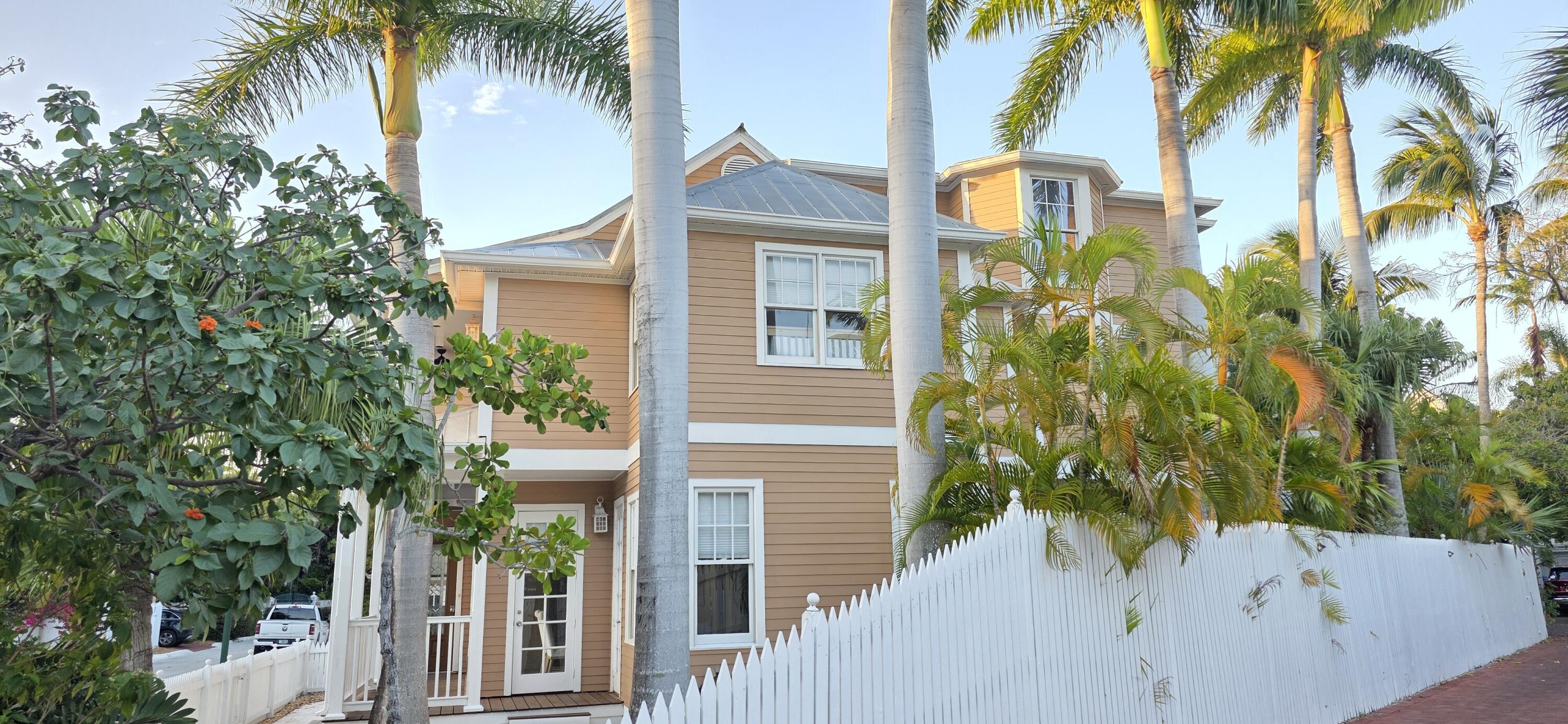 202 Admirals Lane Key West, FL 33040 - Photo 5 of 59 a view of a house with a small yard and plants