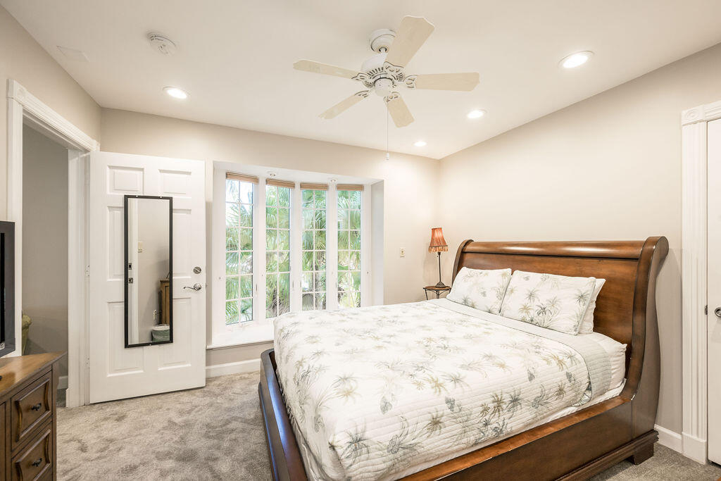 202 Admirals Lane Key West, FL 33040 - Photo 52 of 59 a bed sitting in a spacious bedroom next to a window