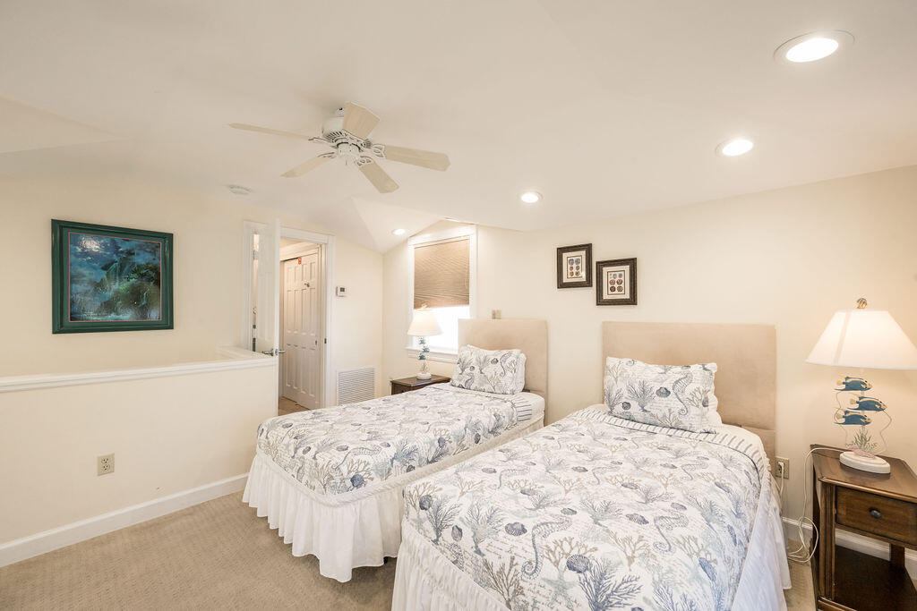 202 Admirals Lane Key West, FL 33040 - Photo 55 of 59 a bedroom with a bed and a lamp