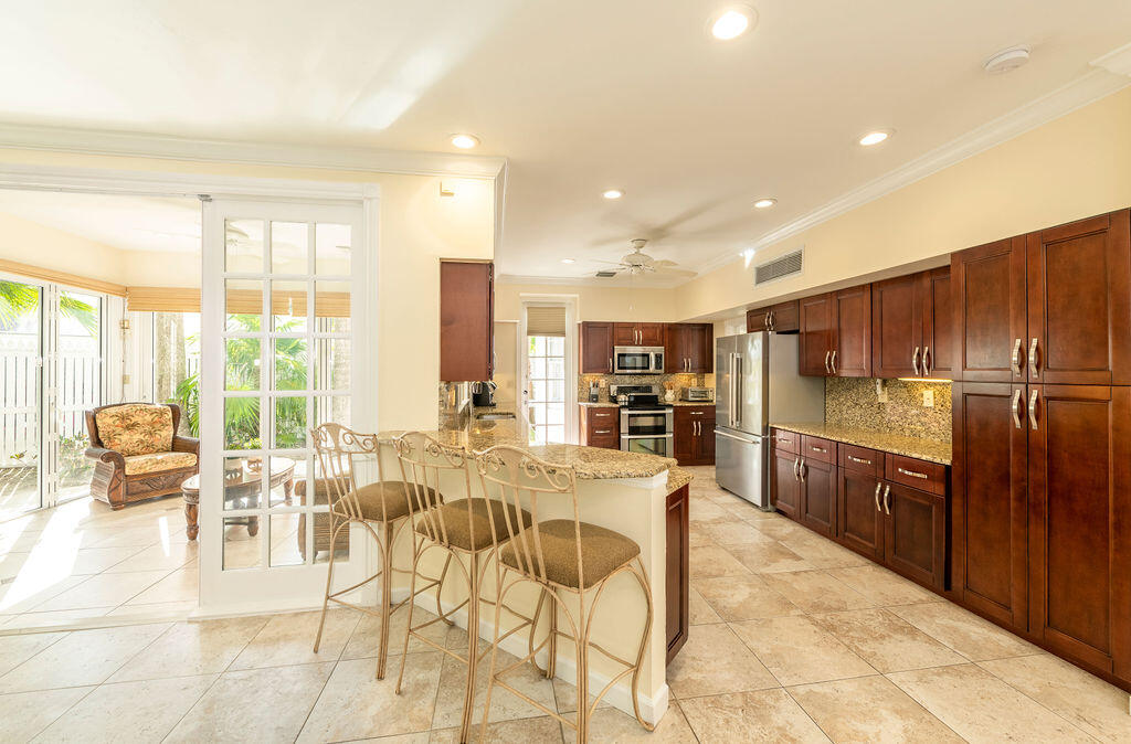 202 Admirals Lane Key West, FL 33040 - Photo 59 of 59 a large kitchen with lots of counter space and furniture