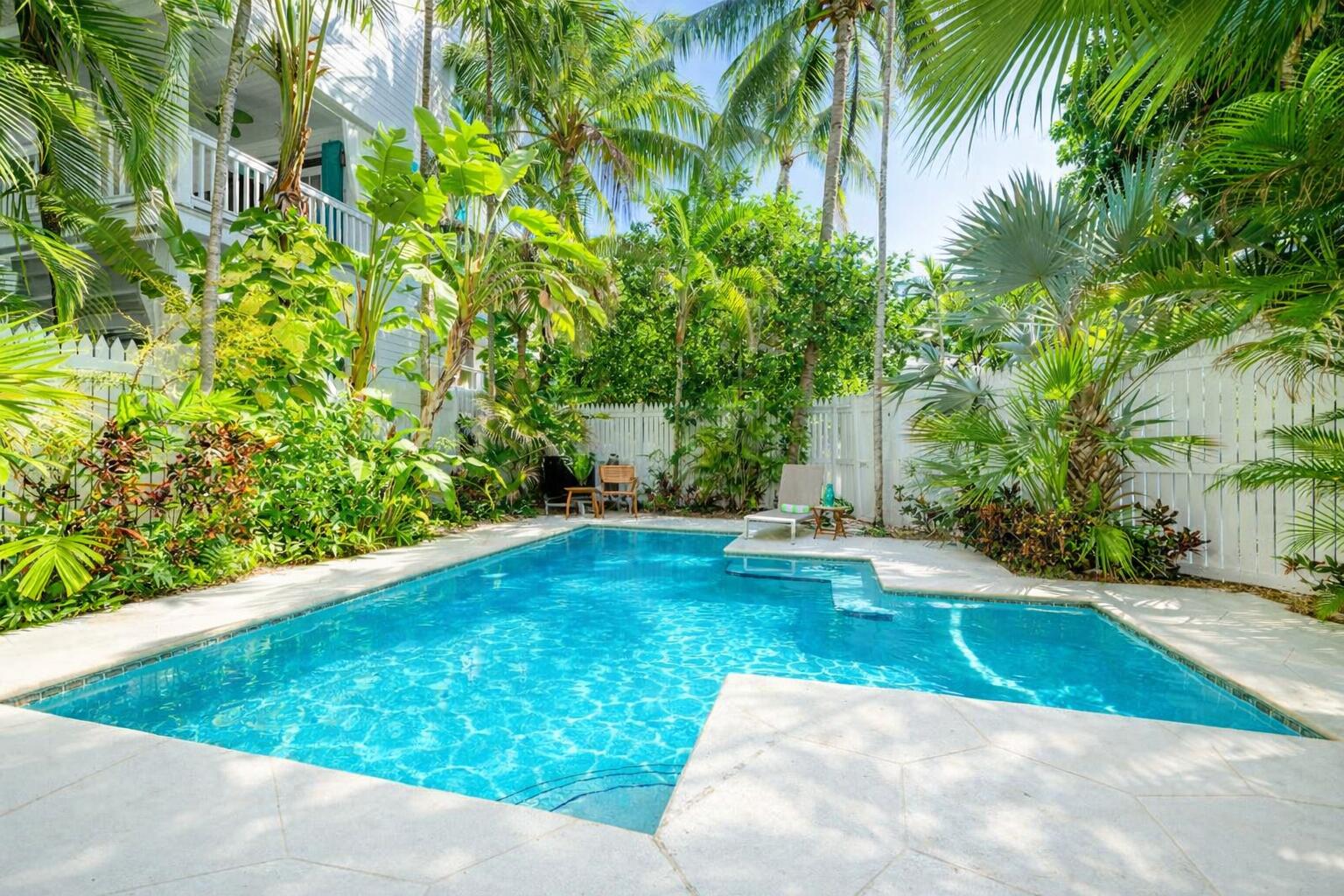 202 Admirals Lane Key West, FL 33040 - Photo 6 of 57 a view of a swimming pool with a backyard