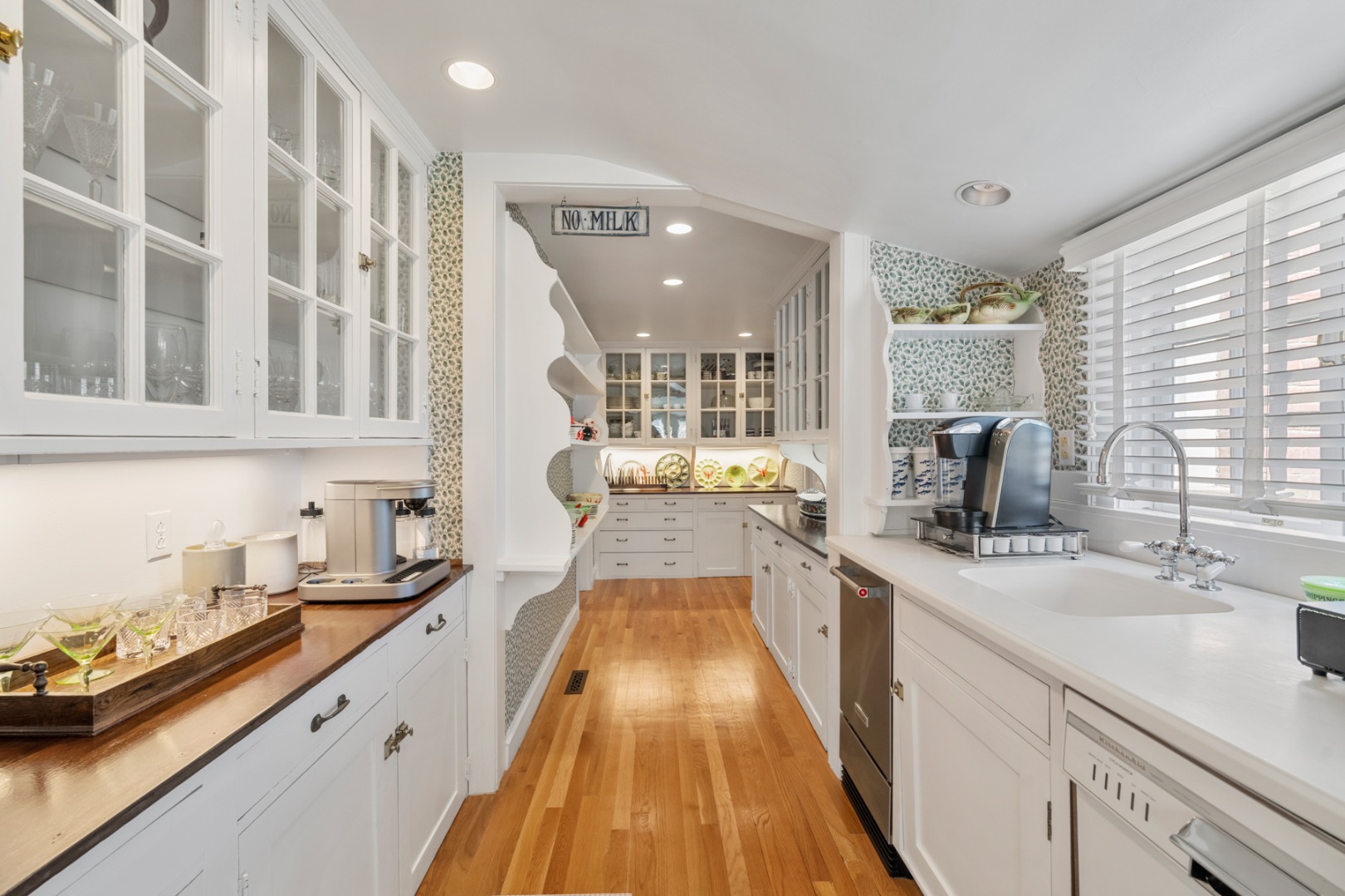 1 Ocean Avenue Nantucket, MA 02554 - Photo 12 of 49 a view of a kitchen with a sink and cabinets