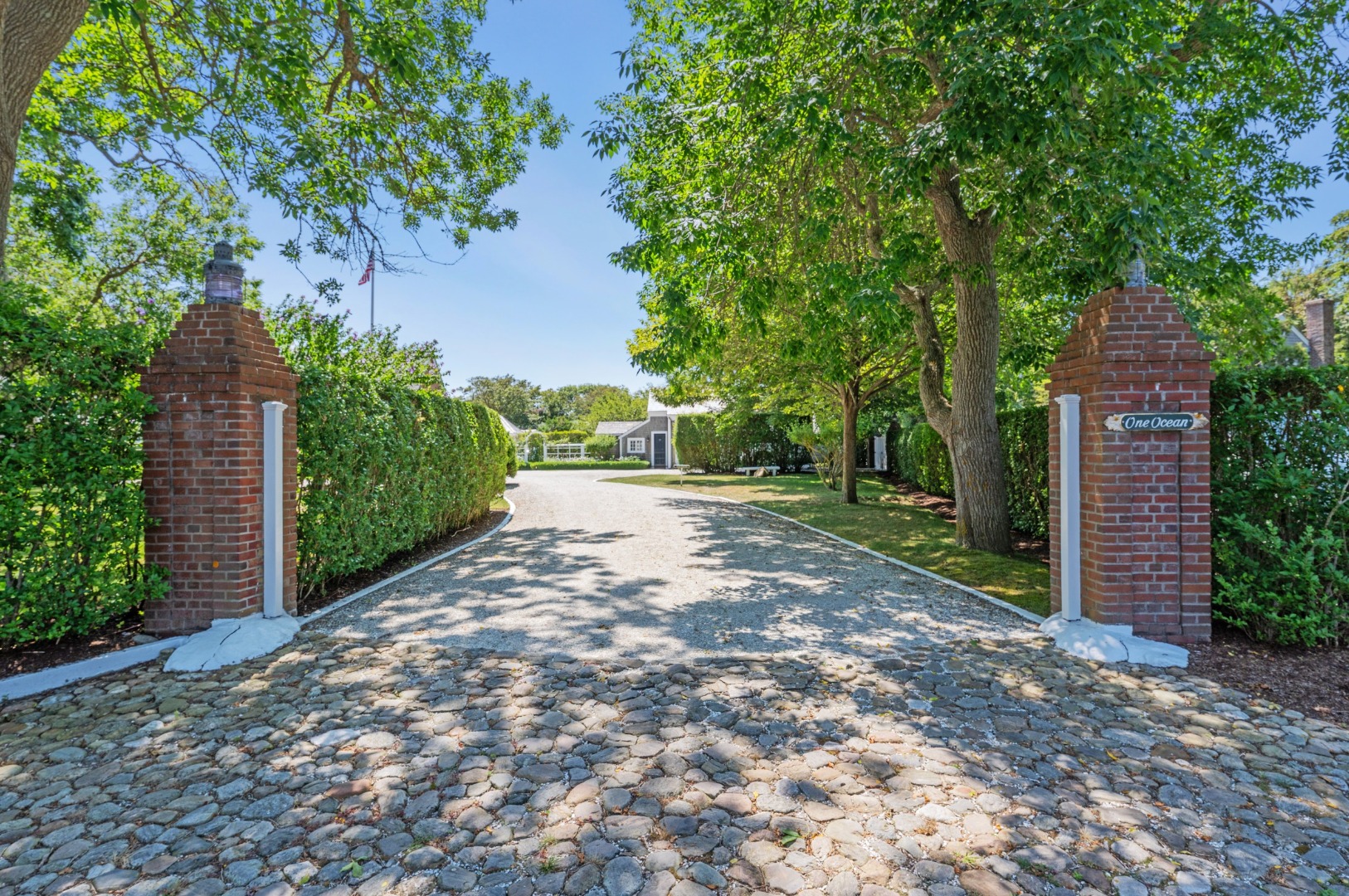 1 Ocean Avenue Nantucket, MA 02554 - Photo 2 of 49 a view of a yard with plants and a large tree