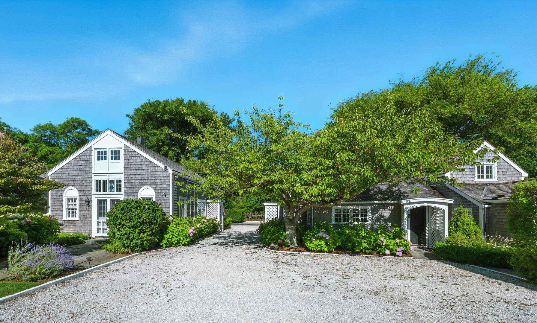1 Ocean Avenue Nantucket, MA 02554 - Photo 39 of 49 a front view of a house with a garden
