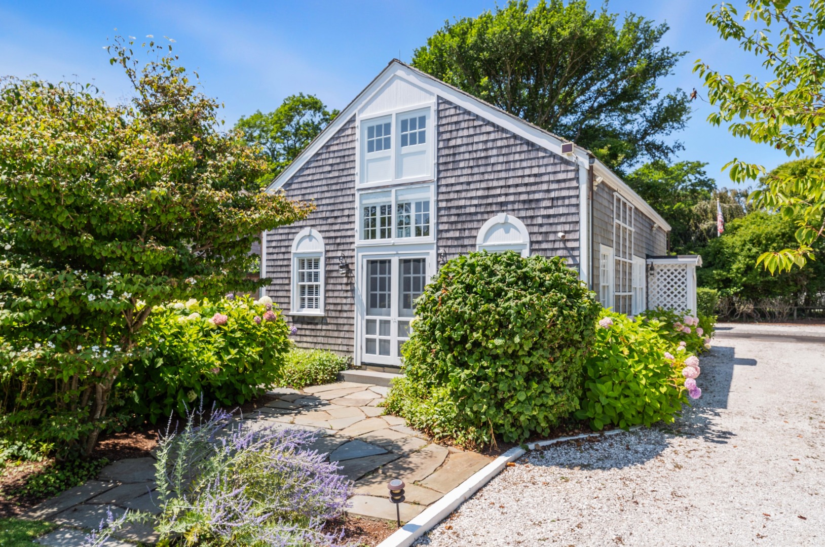 1 Ocean Avenue Nantucket, MA 02554 - Photo 40 of 49 a front view of a house with garden
