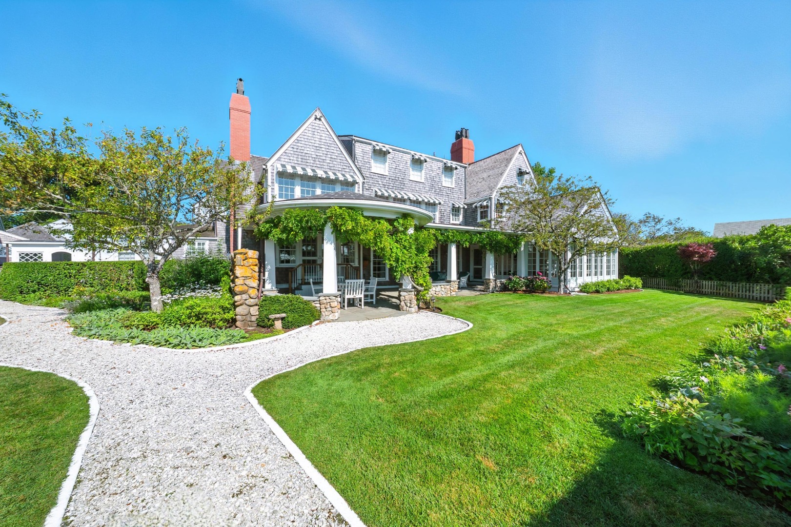 1 Ocean Avenue Nantucket, MA 02554 - Photo 45 of 49 a front view of a house with garden and porch