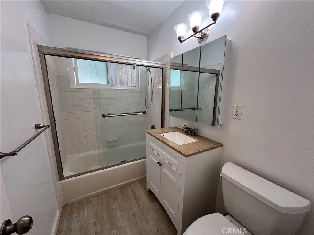 25091 La Cresta Drive, Unit B Dana Point, CA 92629 - Photo 11 of 30 a bathroom with a granite countertop sink toilet and shower