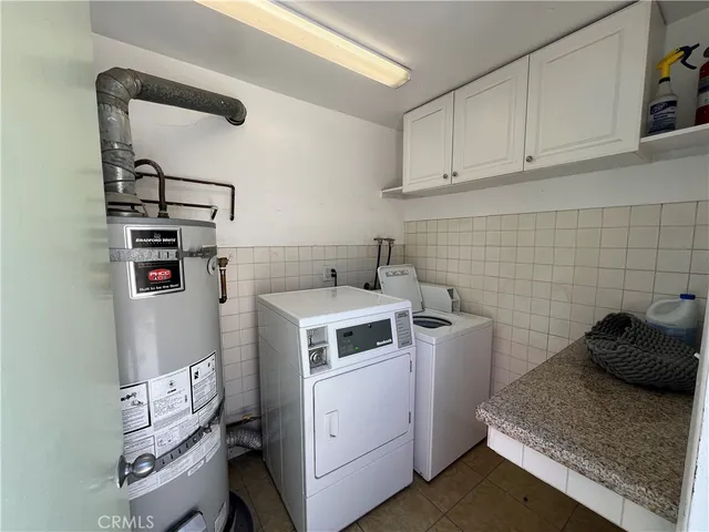 a utility room with cabinets