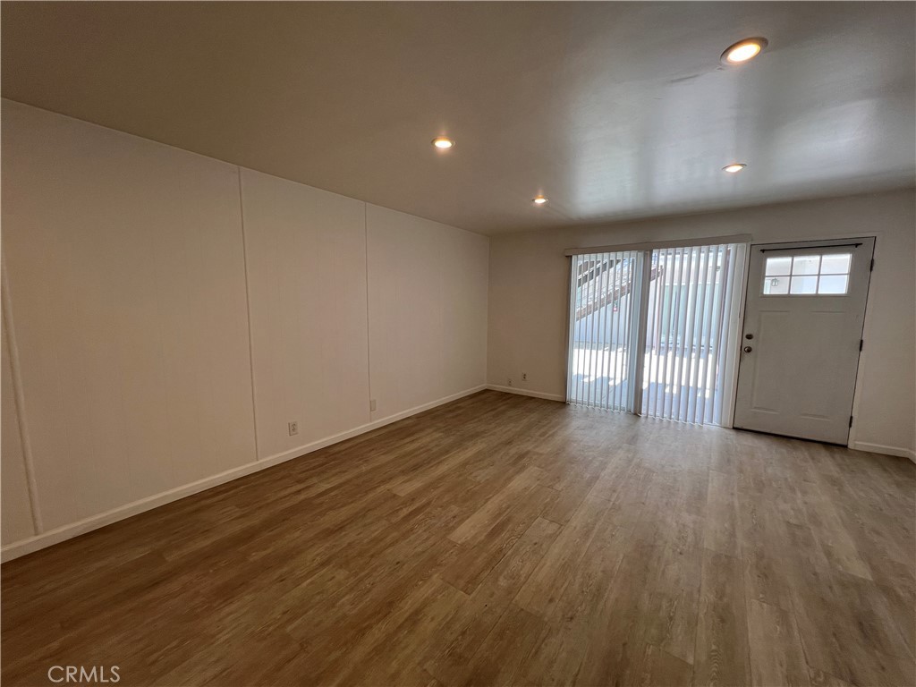 25091 La Cresta Drive, Unit B Dana Point, CA 92629 - Photo 2 of 30 an empty room with wooden floor and windows