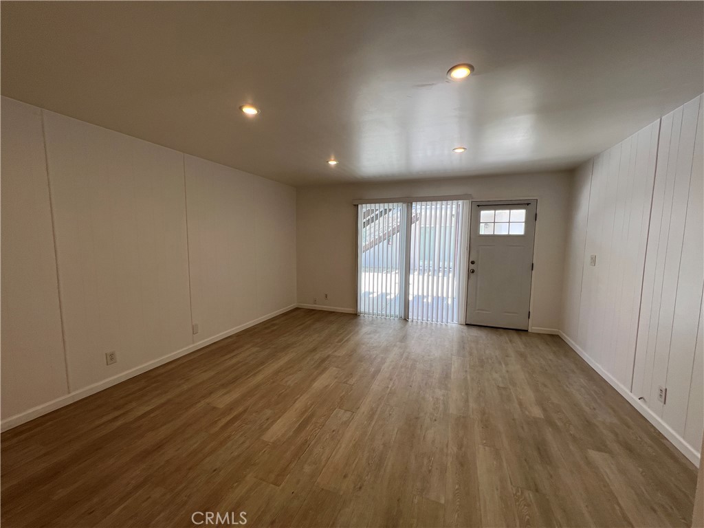 25091 La Cresta Drive, Unit B Dana Point, CA 92629 - Photo 7 of 30 an empty room with wooden floor and natural light