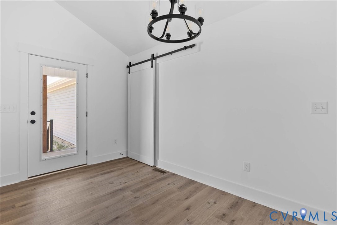 20055 Log Road Disputanta, VA 23842 - Photo 12 of 27 a view of a room with wooden floor and white walls