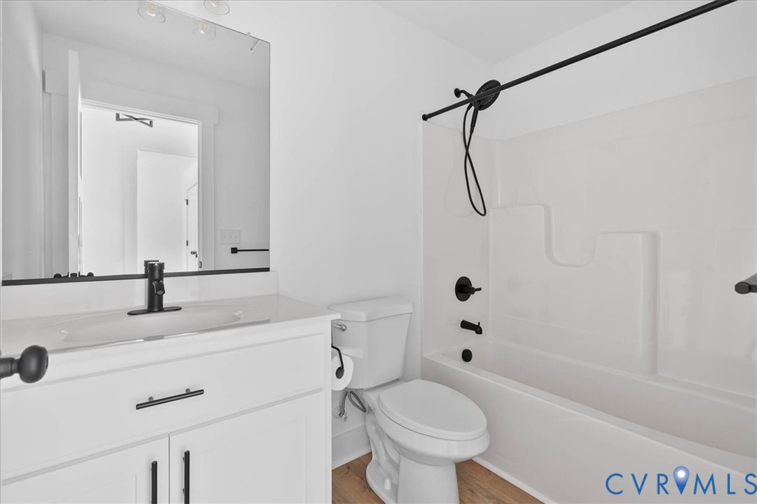 20055 Log Road Disputanta, VA 23842 - Photo 21 of 27 a bathroom with a sink a toilet and a bathtub