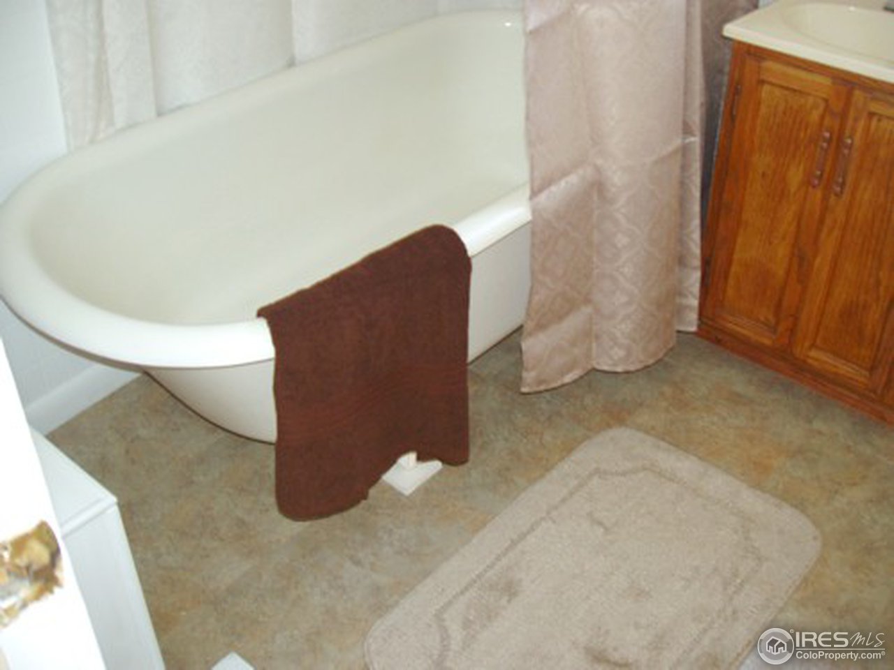 521 Lincoln Street Fort Morgan, CO 80701 - Photo 12 of 12 a view of wooden floor in a living room