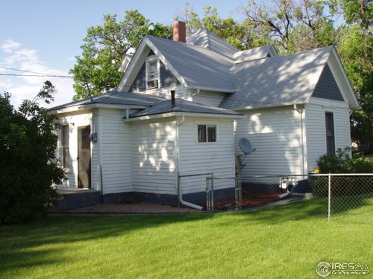 521 Lincoln Street Fort Morgan, CO 80701 - Photo 6 of 12 a view of a house with a backyard