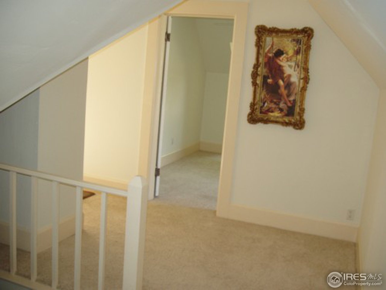 521 Lincoln Street Fort Morgan, CO 80701 - Photo 7 of 12 a view of a hallway with paintings on the wall