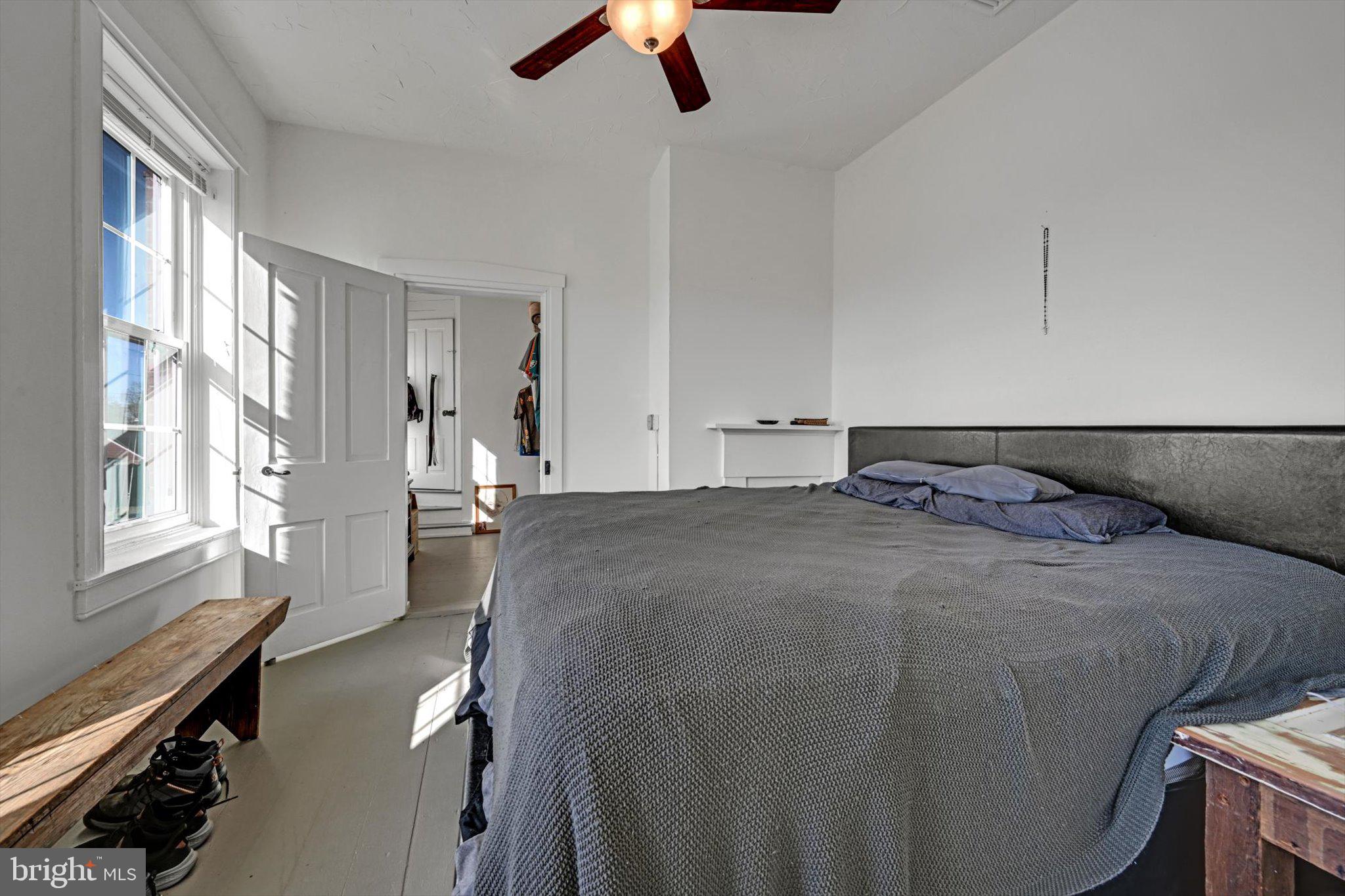 1530 New Holland Road Reading, PA 19607 - Photo 17 of 28 a bed room with a bed and a chandelier